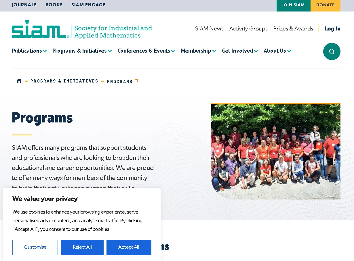 Group photo of students and professionals attending a SIAM program by the Society for Industrial and Applied Mathematics outdoors