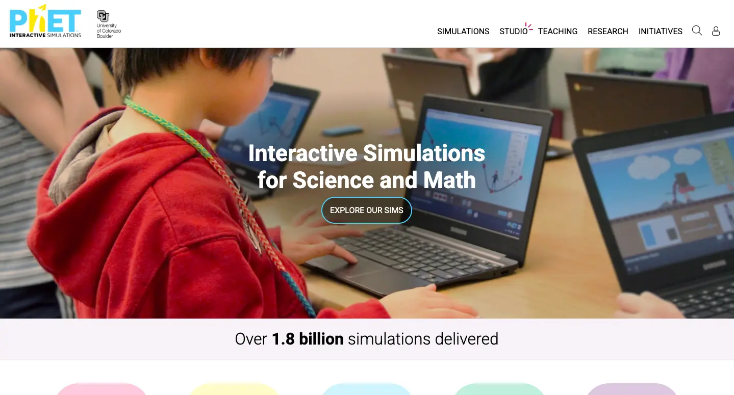 PhET Interactive Simulations homepage showing students using laptops for science and math simulations in a classroom environment